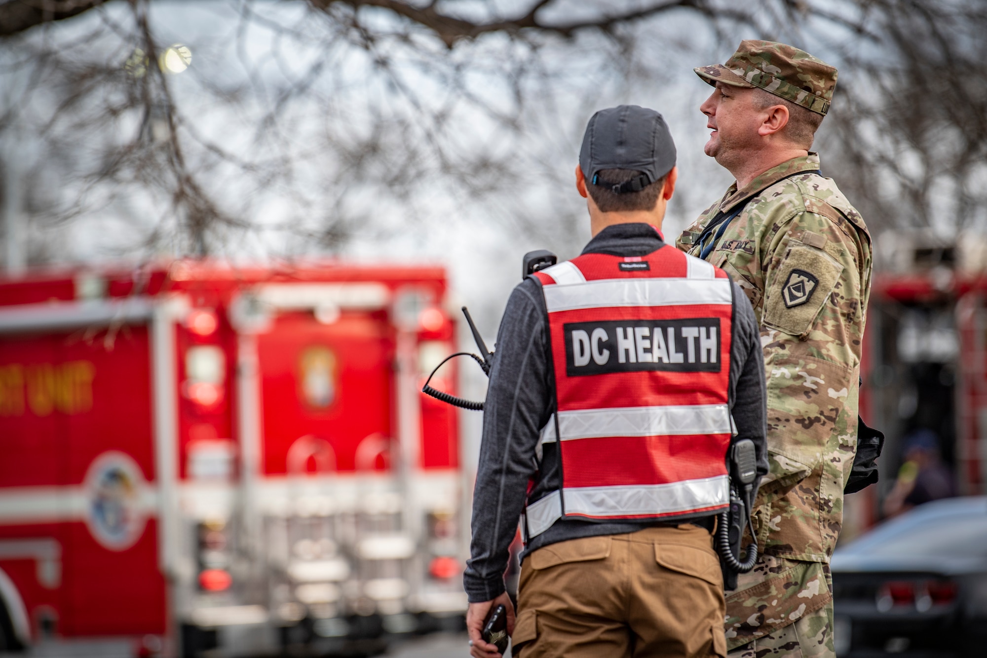 Sgt. 1st Class James Luikart (right), assigned to the West Virginia National Guard’s 35th Civil Support Team, talks with a member of the District of Columbia Health Department in preparation for 2020 State of the Union Address on Feb. 4, 2020 in Washington, D.C. The 35th CST was strategically prepositioned to provide support to and in conjunction with the D.C. Fire and Emergency Management Services, the USCP, the D.C. National Guard and many other civil and federal agencies for the SOTUA. (U.S. Air National Guard Photo by Staff Sgt. Caleb Vance)