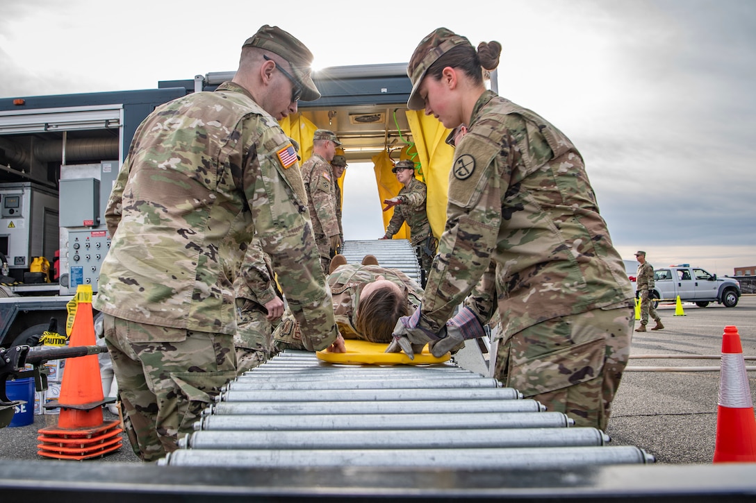 Soldiers and Airmen assigned to West Virginia National Guard’s 35th Chemical, Biological, Radiological, Nuclear or Explosive Enhanced Response Force Packages put a mock patient through the decontamination process while participating in a response rehearsal at Joint Base Anacostia-Bolling, Washington D.C., in preparation for the 2020 State of the Union Address, Feb. 3, 2020. The 35th CERF-P is a joint-force unit comprised of the 130th Airlift Wing’s CERF-P Detachment and Soldiers from the West Virginia Army National Guard, whose mission is to preposition at high-profile events in preparation to support civil authorities at domestic CBRNE incident sites. (U.S. Air National Guard Photo by Staff Sgt. Caleb Vance)