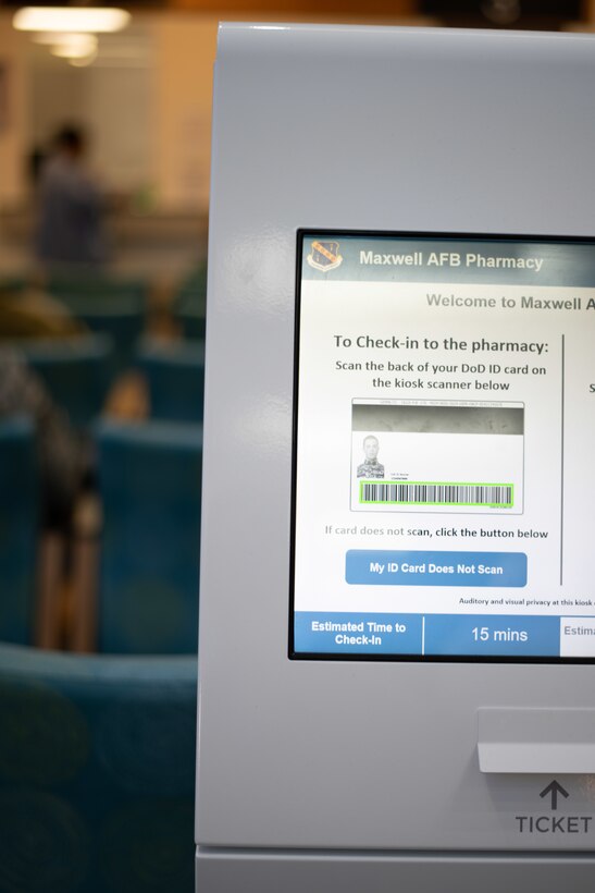 One of the two QFlow kiosks located at the Maxwell Pharmacy, Maxwell Air Force Base, Alabama. The QFlow kiosks displays the estimated wait time and allows patients to choose how they want to be notified that their prescription are ready, which gives patients more choices on how they spend their time.  (U.S. Air Force photo by Senior Airman Alexa Culbert)