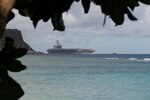 The aircraft carrier Theodore Roosevelt (CVN 71) transits Apra Harbor as the ship prepares to moor in Guam. Theodore Roosevelt Is in Guam for a port visit during their scheduled deployment to the Indo-Pacific.