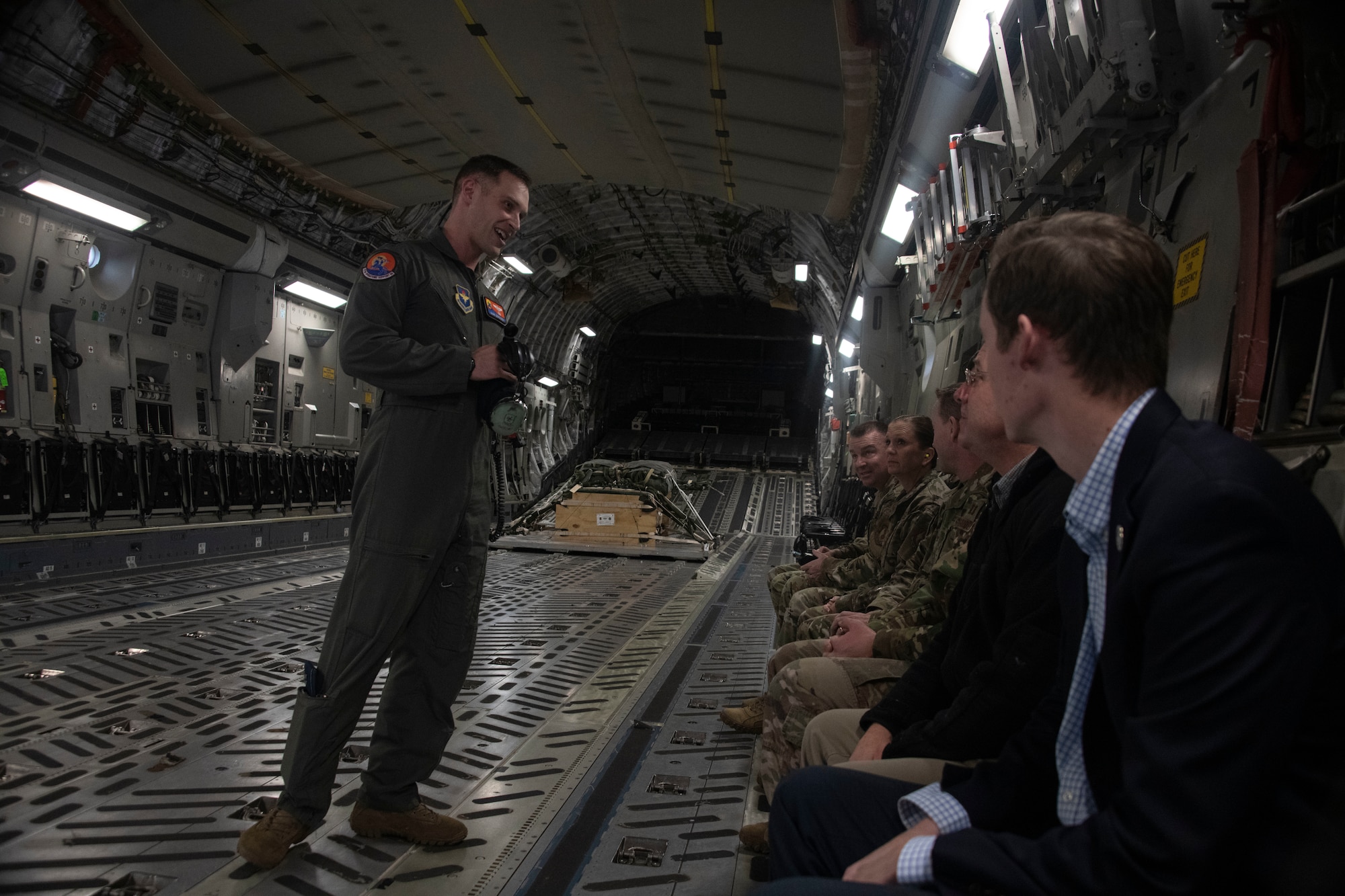 U.S. Air Force Capt. Mark Benischek, the wing tactics flight commander assigned to the 97th Operations Support Squadron, briefs emergency procedures to members of the Oklahoma Commanders Summit