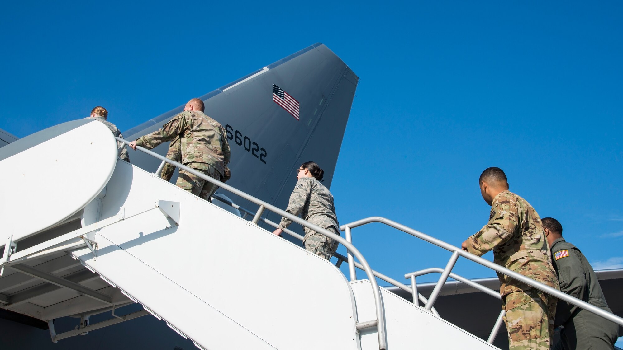 U.S. Air Force Airmen ascend a ramp to a KC-46 Pegasus aircraft assigned to McConnell Air Force Base, Kan., at MacDill Air Force Base, Fla., Jan. 29, 2020.