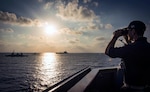 Ensign observes Israeli INS Lahav, left, INS Sufa, center, and USNS Leroy Grumman from USS Carney during exercise Reliant Mermaid 2018, Mediterranean Sea, August 7, 2018 (U.S. Navy/Ryan U. Kledzik)