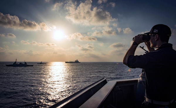 Ensign observes Israeli INS Lahav, left, INS Sufa, center, and USNS Leroy Grumman from USS Carney during exercise Reliant Mermaid 2018, Mediterranean Sea, August 7, 2018 (U.S. Navy/Ryan U. Kledzik)