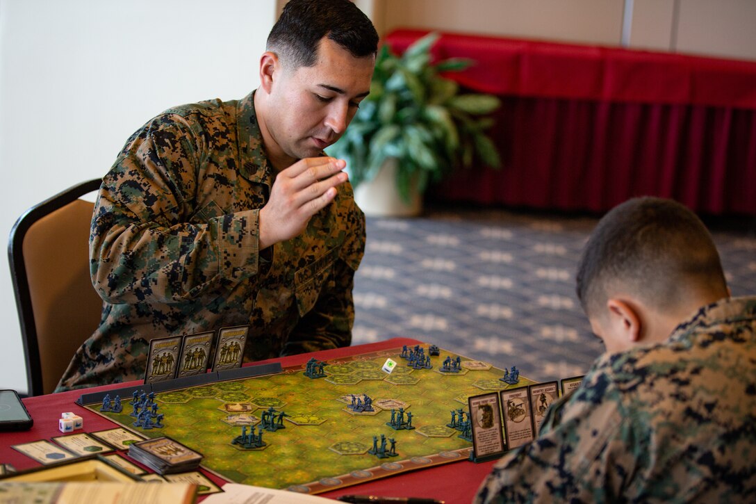 Marine rolls die during game of war-themed strategy board game Memoir ’44 on Camp Schwab, Okinawa, Japan, December 10, 2019 (U.S. Marine Corps/
Timothy Hernandez)