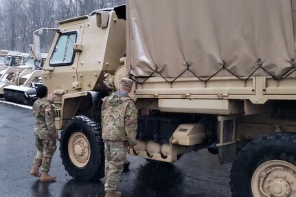 Virginia National Guard Soldiers assigned to the Cedar Bluff-based 1033rd Engineer Company, 276th Engineer Battalion, 329th Regional Support Group conduct maintenance checks on their light/medium tactical truck Feb. 7, 2020, in Cedar Bluff, Virginia.