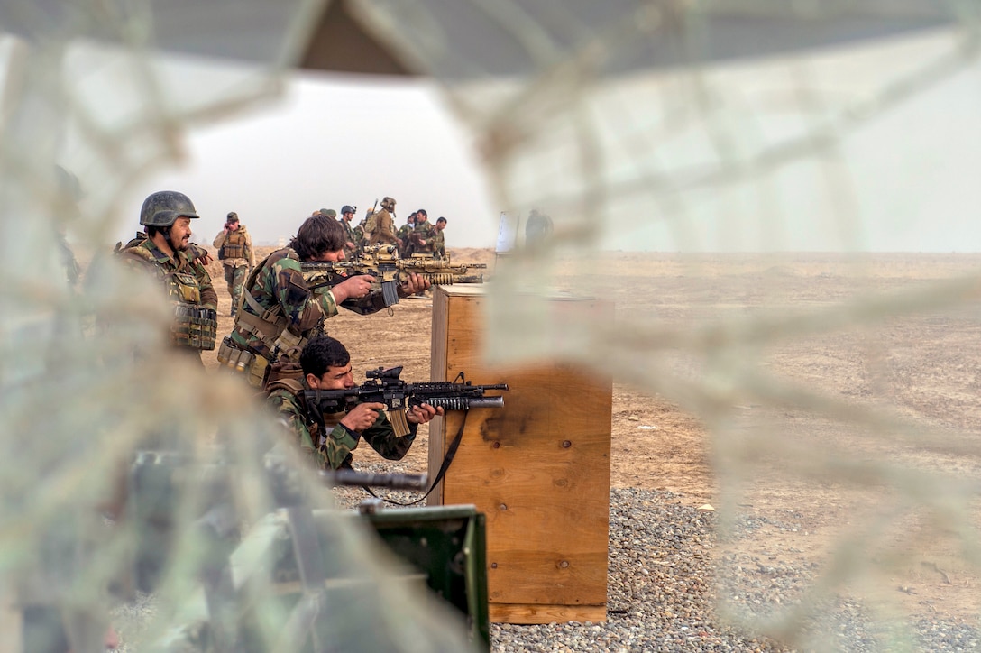 Afghan National Army 10th Special Operation Kandak commandos conduct small arms barrier firing drills during series of weapons proficiency ranges at
Camp Pamir, Kunduz Province, Afghanistan, January 13, 2018 (U.S. Air Force/Sean Carnes)