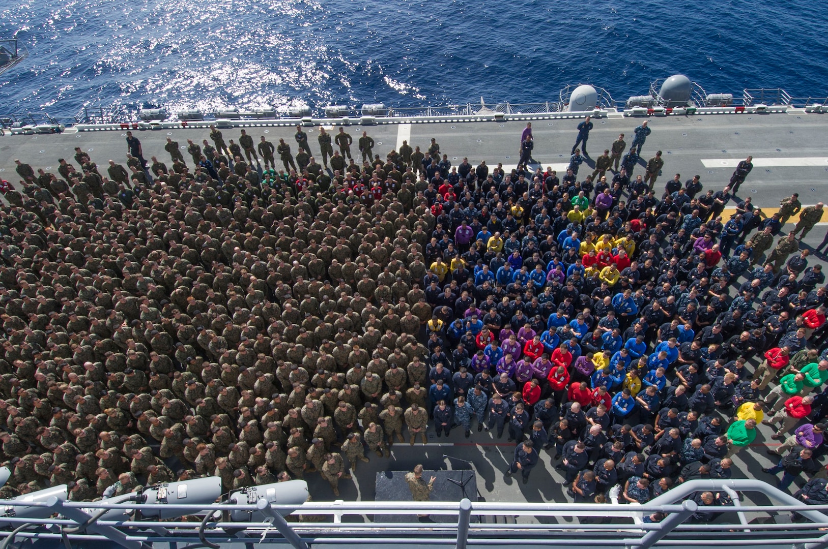 Commander Task Force 51 Marine Major General Carl E. Mundy III addresses Sailors and Marines during all-hands call on flight deck of USS Essex, Pacific Ocean, February 26, 2015 (U.S. Navy/Jason M. Graham)