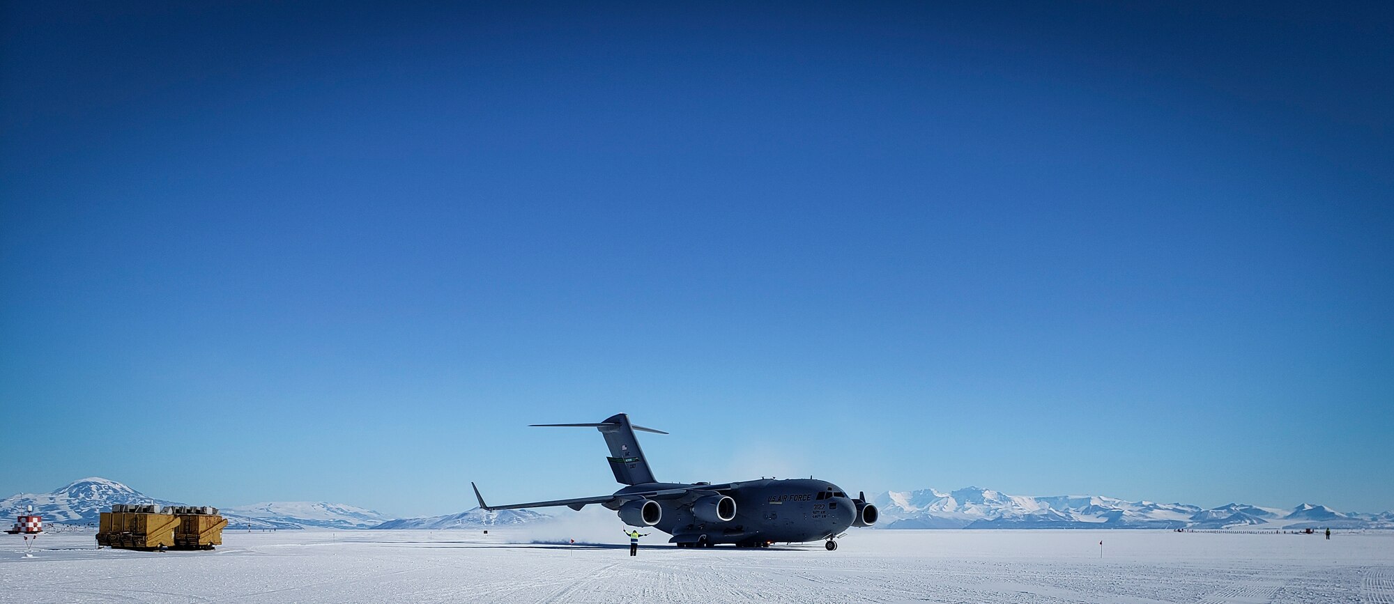 U.S. Air Force Master Sgt. Justin Rogers, an occupational safety specialist, 108th Wing, New Jersey Air National Guard, watches as a C-17 Globemaster arrives at McMurdo Station, Antarctica, Nov. 15, 2019.  Antarctica does not have a military mission, but the National Science Foundation receives airlift support from the 109th Airlift Wing, New York Air National Guard.Rogers backfilled as the 109th Safety Manager while at McMurdo Station. (Courtesy Photo)