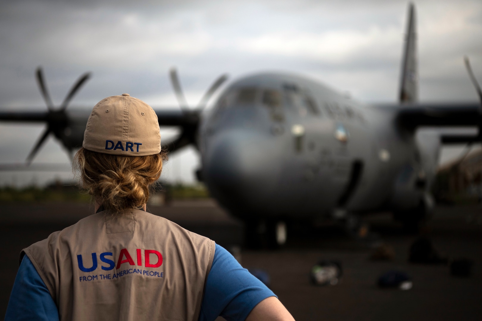 U.S. Agency for International Development worker waits for flight on C-130J Hercules assigned to 75th Expeditionary Airlift Squadron, Combined Joint
Task Force–Horn of Africa, in Maputo, Mozambique, March 29, 2019 (U.S. Air Force/Chris Hibben)