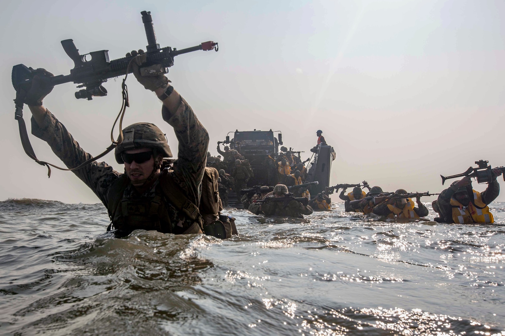 Marines currently under 4th Marine Regiment, 3rd Marine Division, and members of Indian military wade to shore during exercise Tiger Triumph, on
Kakinada Beach, India, November 19, 2019 (U.S. Marine Corps/Christian Ayers)