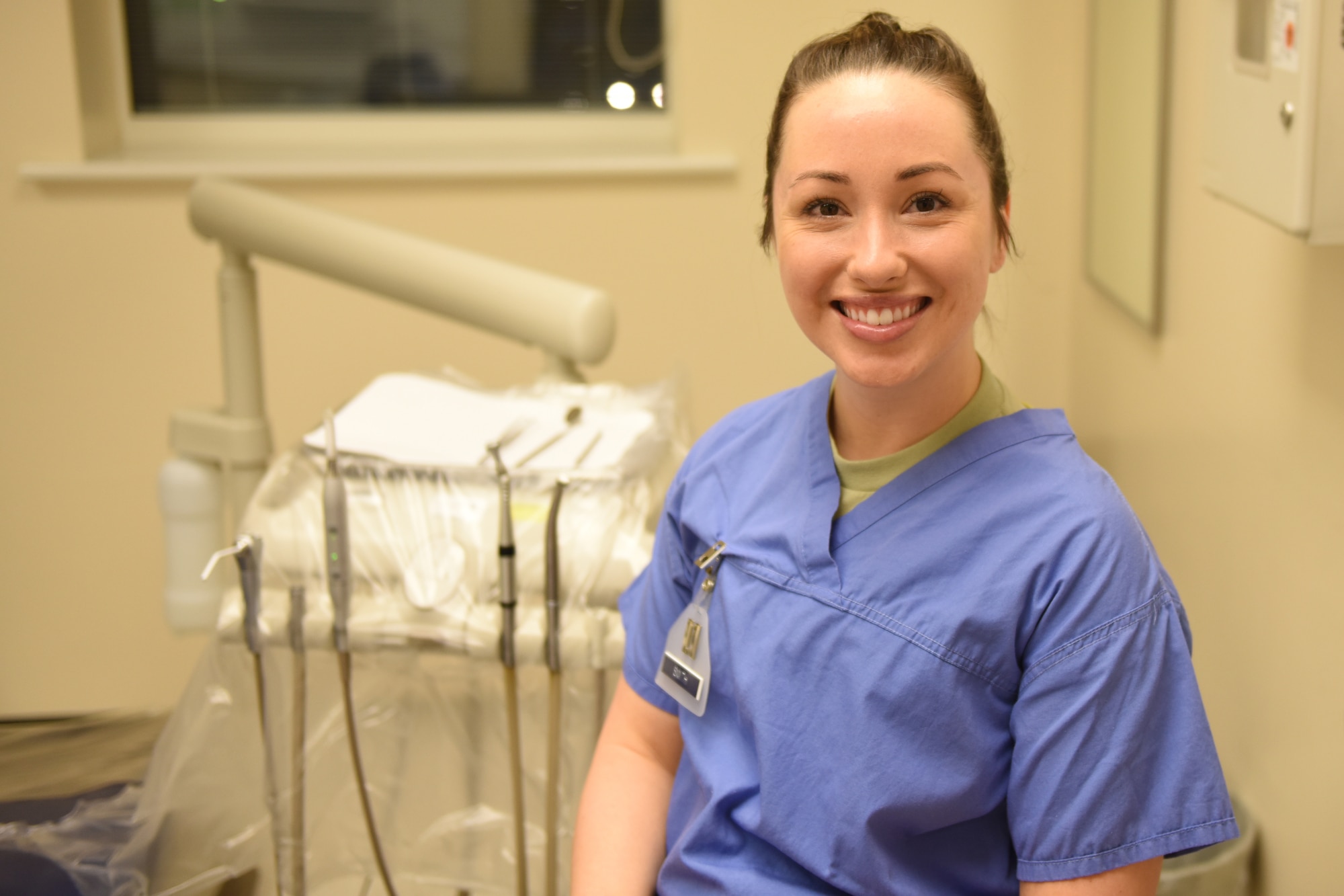 Capt. Jessica K. Smith, a general dentist assigned to the 48th Dental Squadron, sits in her treatment room at Royal Air Force Lakenheath, England, Jan. 30, 2020. The 48th DS mission is to provide excellent, best-value oral health for readiness. (U.S. Air Force photo by Airman 1st Class Jessi Monte)