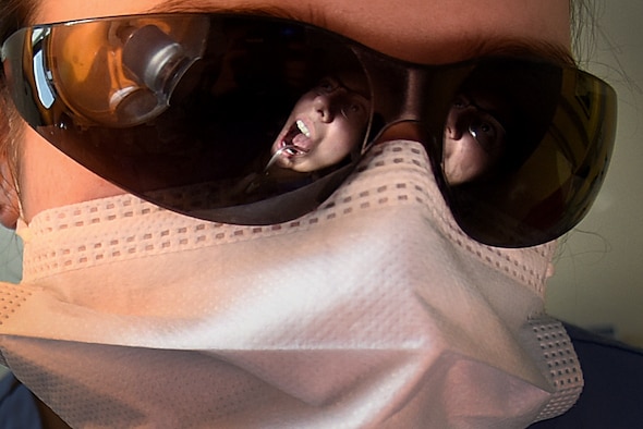 A dental technician assigned to the 48th Dental Squadron prepares for a routine teeth cleaning at Royal Air Force Lakenheath, England, Feb. 6, 2020. The 48th DS mission is to provide excellent, best-value oral health for readiness. (U.S. Air Force photo by Airman 1st Class Jessi Monte)