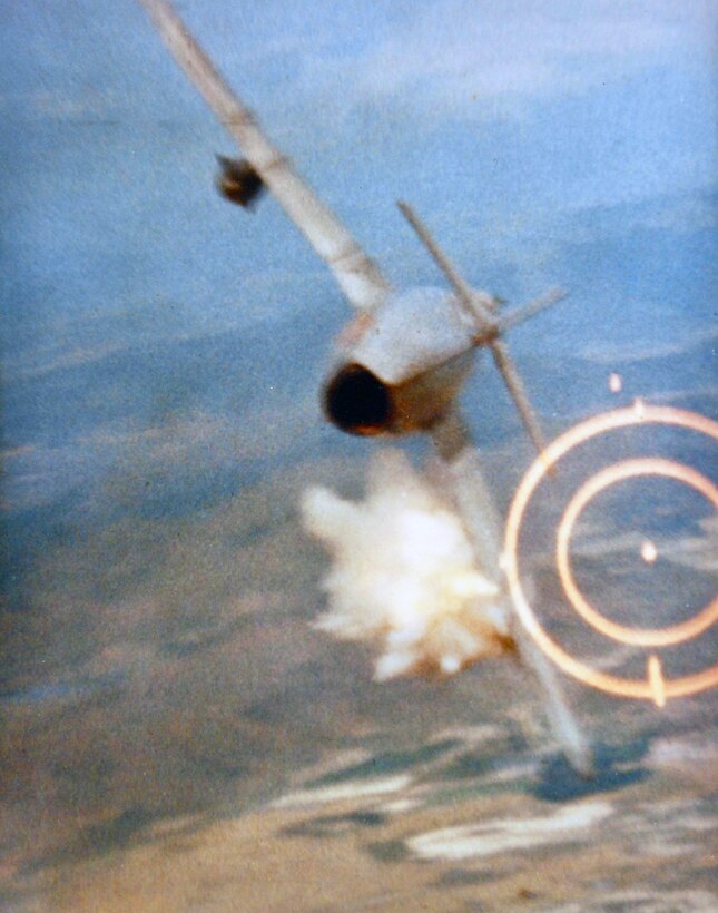During Vietnam War, Airman fires 20mm cannon at point-blank range from F-105 while passing 15 to 20 feet below MiG, hitting left wing near fuselage as it bursts into flames (U.S. Air Force/National Archives and Records Administration)