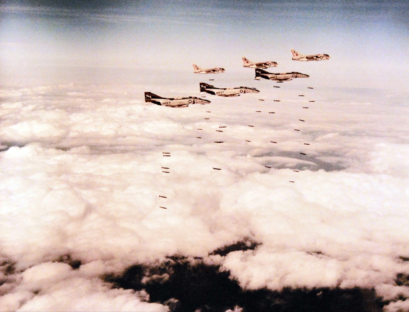 Three fighter squadron 161 Phantom II fighter aircraft from USS Midway and three Corsair II attack aircraft from USS America drop Loran bombs during
strike mission in Vietnam, March 1973 (U.S. Navy/National Archives and Records Administration/Fred P. Leonard)