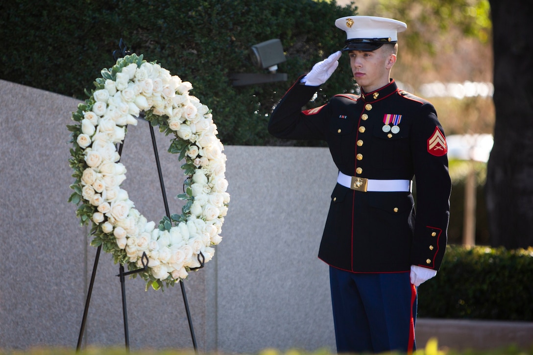 U.S. Marine Cpl. Dylan Ackerman, an administrative specialist with Headquarters and Service Company, Headquarters and Support Battalion, Marine Corps Installations West, Marine Corps Base Camp Pendleton, salutes a white rose wreath during a wreath laying ceremony for the 109th anniversary of President Ronald Reagan’s birthday at the Ronald Reagan Presidential Library in Simi Valley, California, Feb. 6, 2020. The ceremony is an annual event to commemorate Reagan’s life and legacy, with a ceremony being held every year on his birthday by presidential declaration since his death in 2004. (U.S. Marine Corps photo by Cpl. Dylan Chagnon)