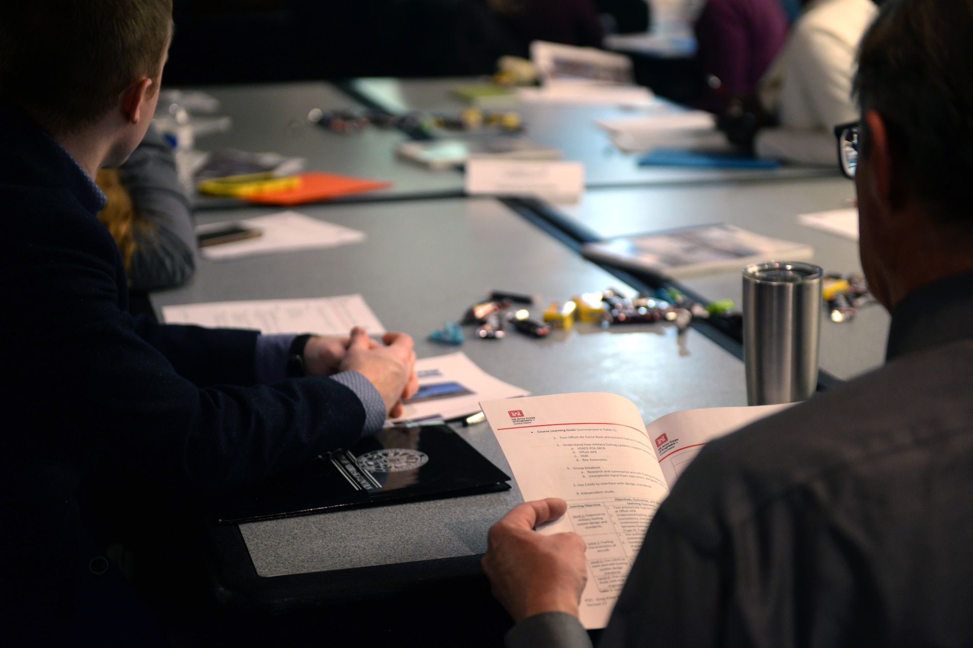People sitting in a workshop.