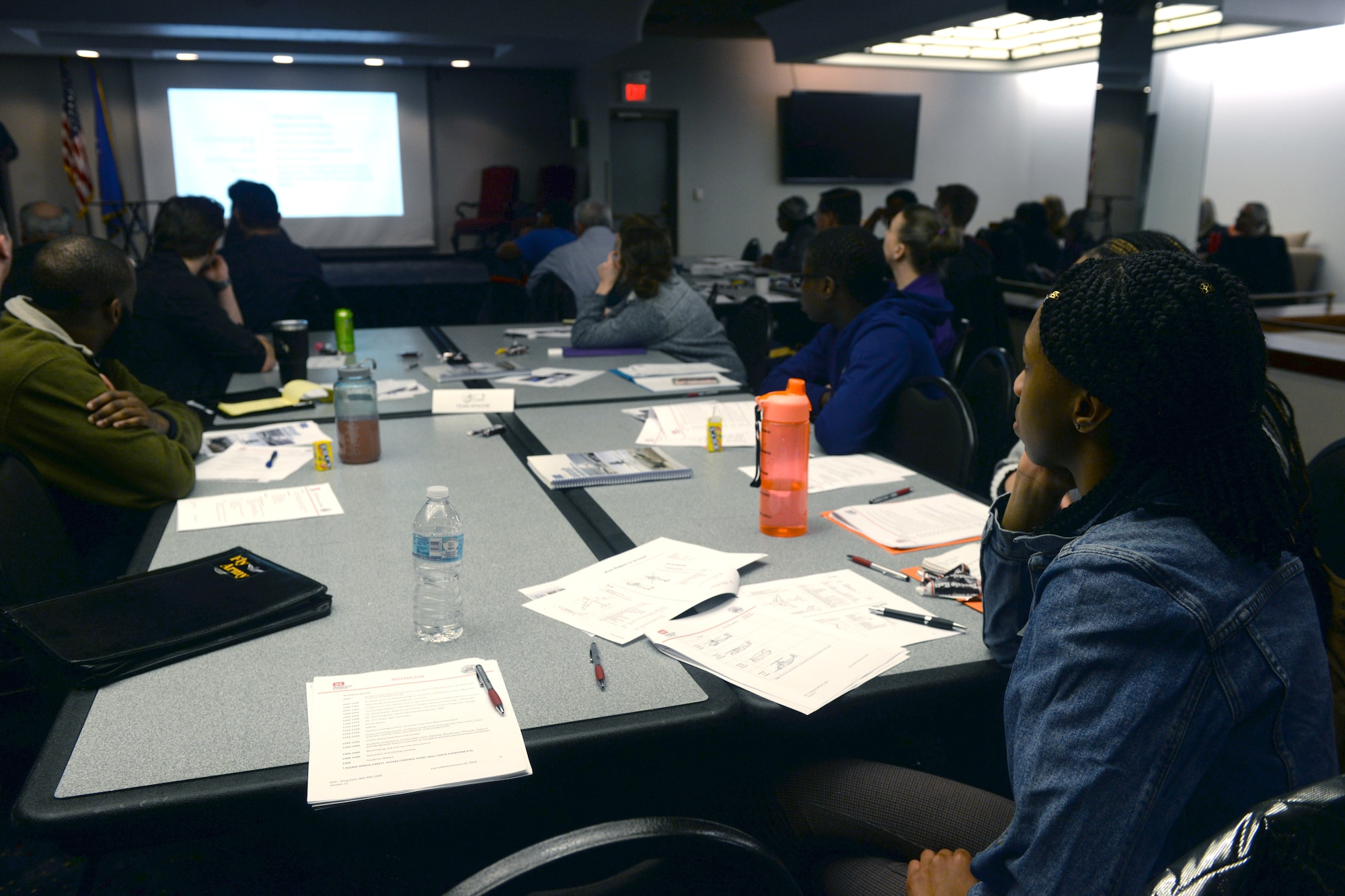 Students sitting at a table during a workshop.