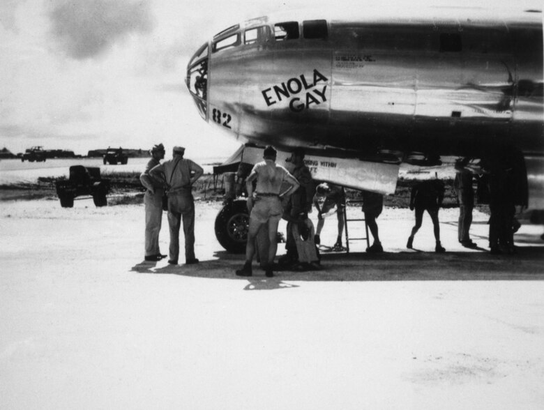 Crews stand near the nose of the B-29 Superfortress nicked named "Enola Gay."