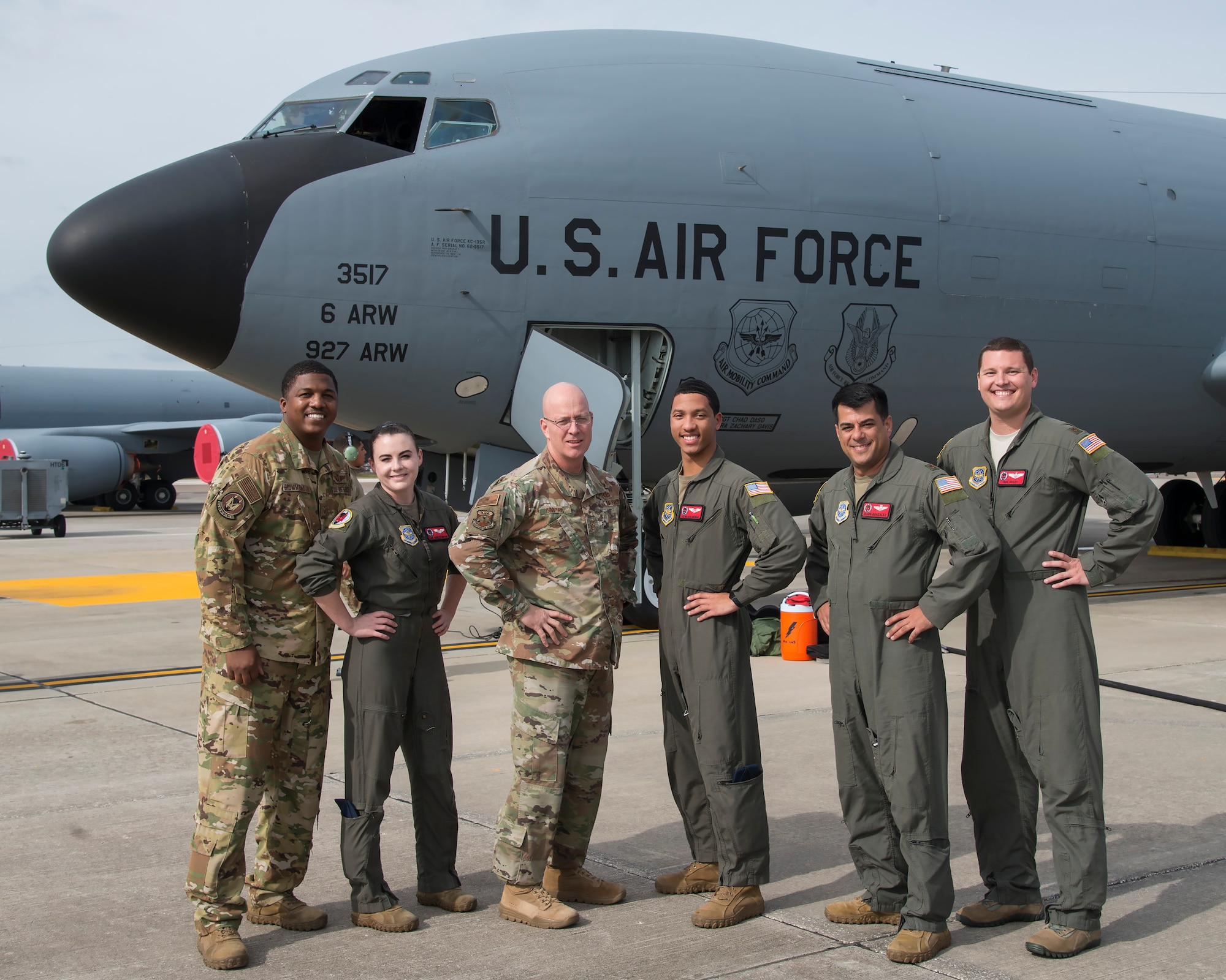 U.S. Air Force Chief Master Sgt. Daniel Simpson, the 18th Air Force command chief, pauses for a photo with 50th Air Refueling Squadron aircrew at MacDill Air Force Base, Fla., Jan. 30, 2020.