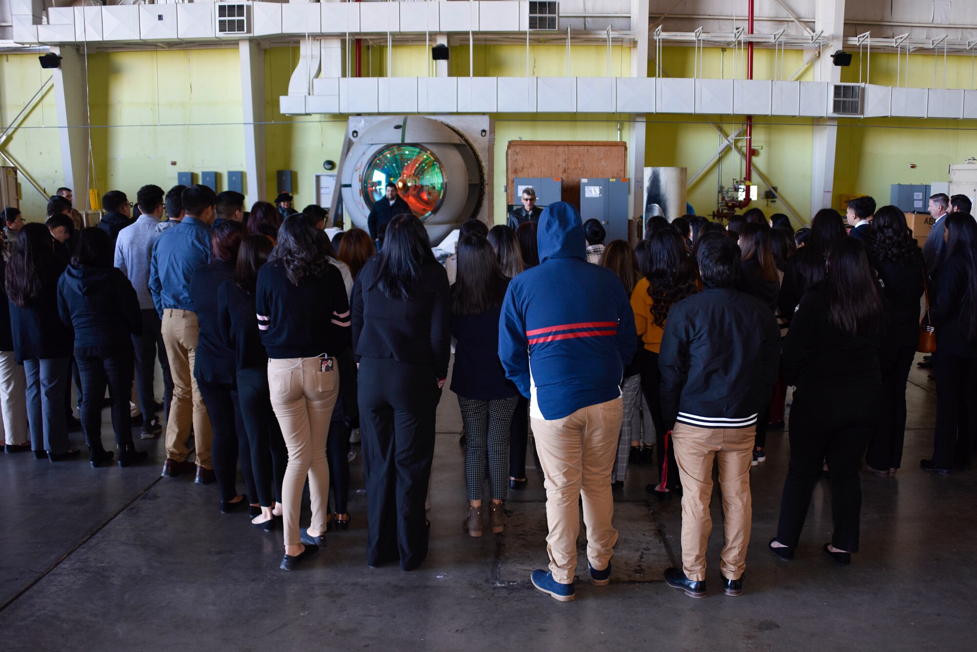 Photo of a group of students looking at an Airborne Laser Turret.