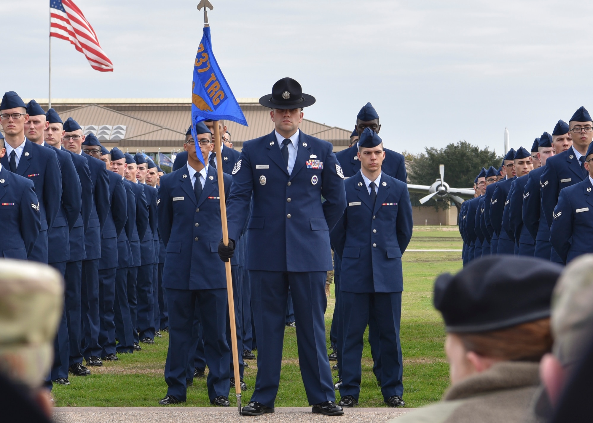 Photo of Air Force basic military training Airmen standing at ease.