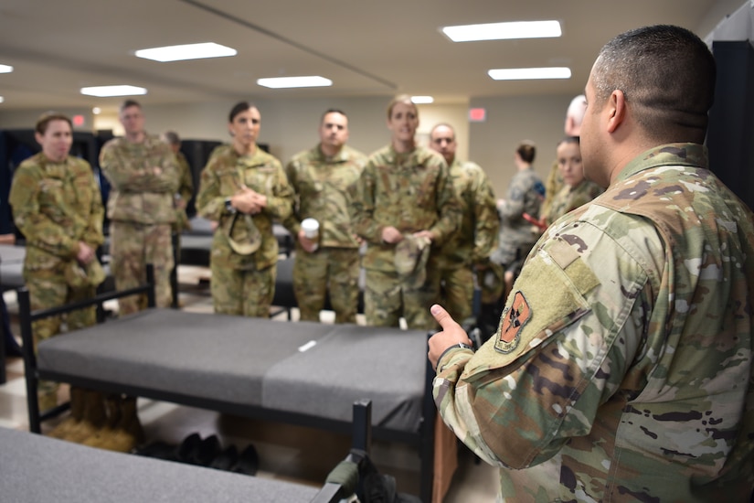 Photo of senior leaders listening to military training instructors.