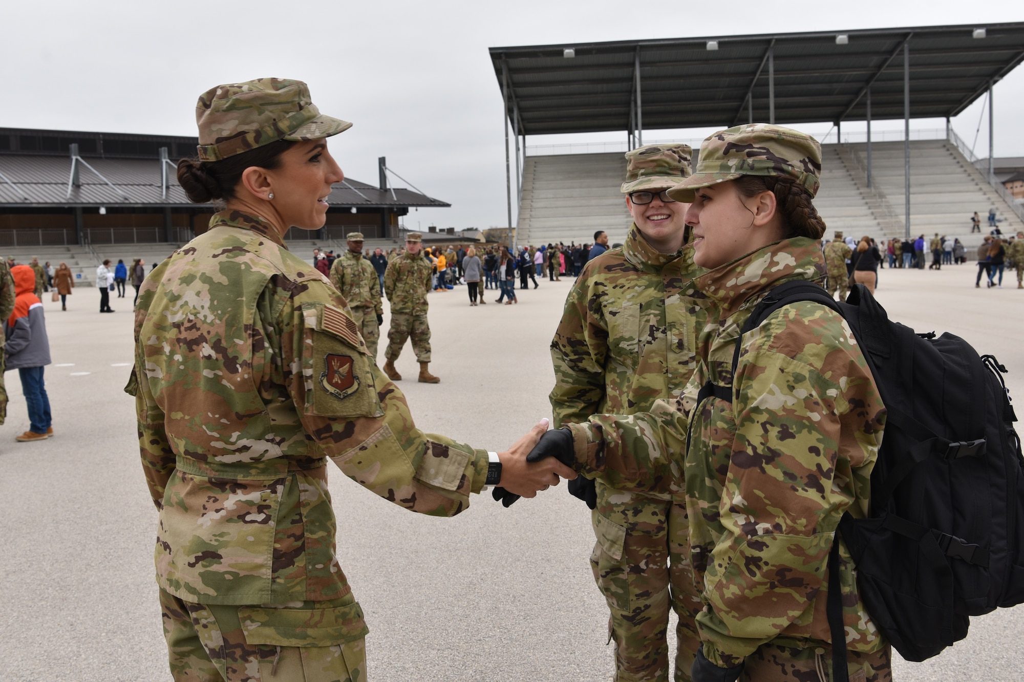 Photo of a superintendent shaking hands with a graduate.