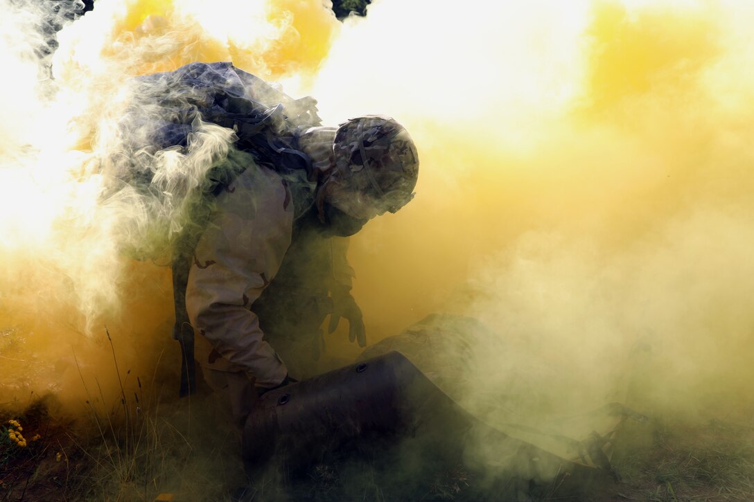 Combat medic assigned to Landstuhl Regional Medical Center, Regional Health Command–Europe secures simulated casualty during simulated attack asapart of 21st Theater Sustainment Command Best Medic Competition, Baumholder, Germany, August 22, 2019 (U.S. Army/Jesse Pilgrim)