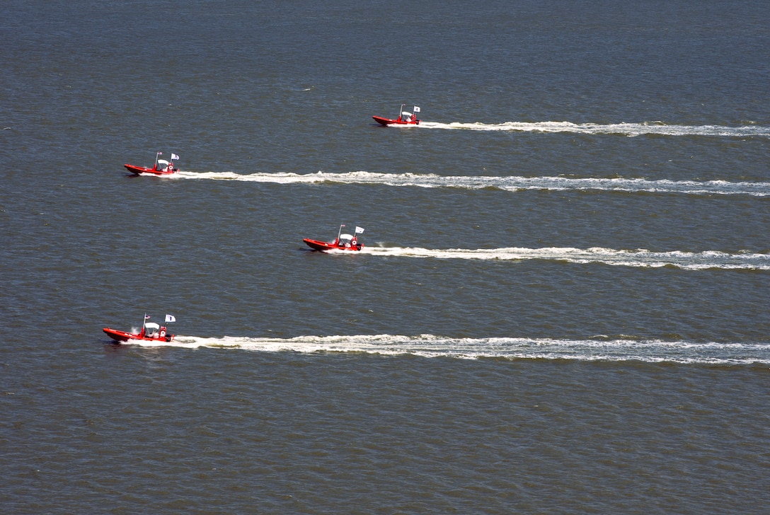 Four unmanned remotely operated high-speed maneuvering surface targets move to blocking positions on James River during Office of Naval Research–
sponsored demonstration of autonomous swarmboat technology, Newport News, Virginia, August 13, 2014 (U.S. Navy/John Paul Kotara)