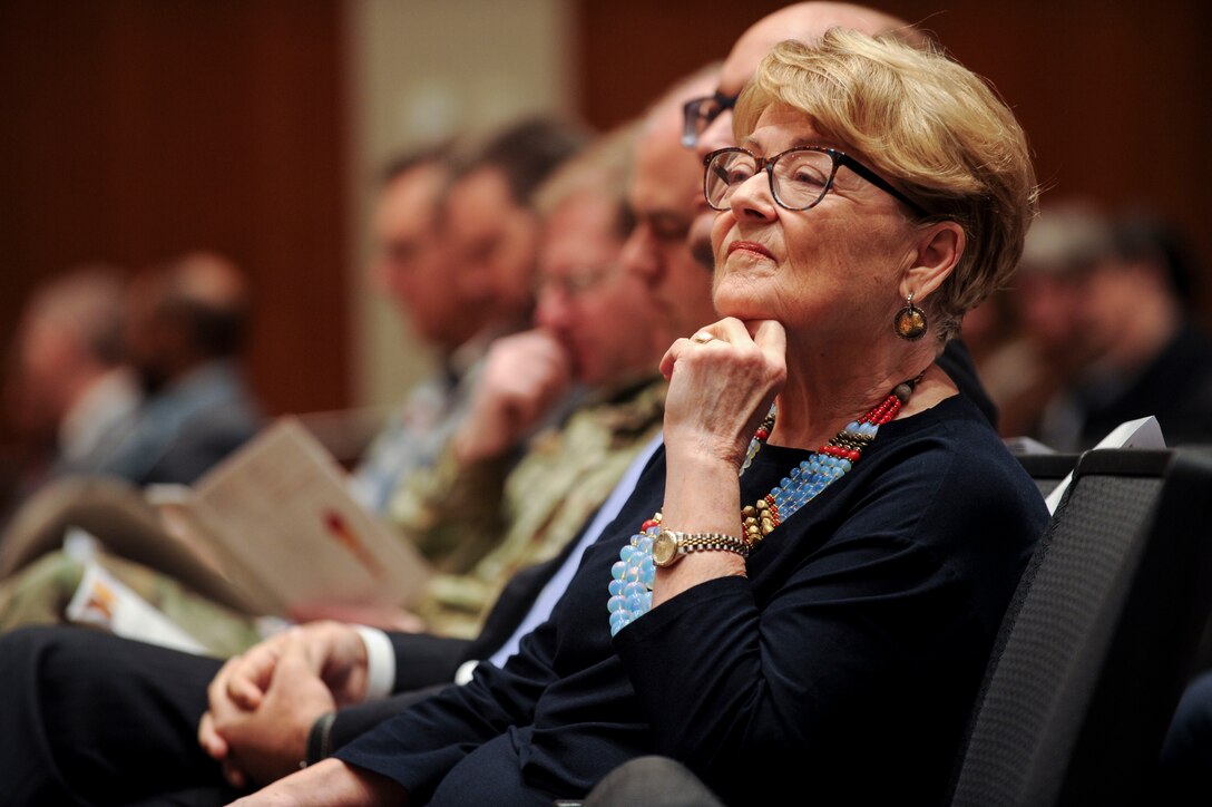 Marjorie Doyle, the guest speaker for the National Air and Space Intelligence Center Civilian Career Development Program graduation ceremony, waits in the audience at Wright-Patterson AFB, Ohio, Jan. 30, 2020. During the event, Doyle shared her insights on how an organization must establish its values and consistently employ them to drive mission accomplishment and unit cohesion. (U.S. Air Force photo Staff Sgt. Seth Ray Stang)