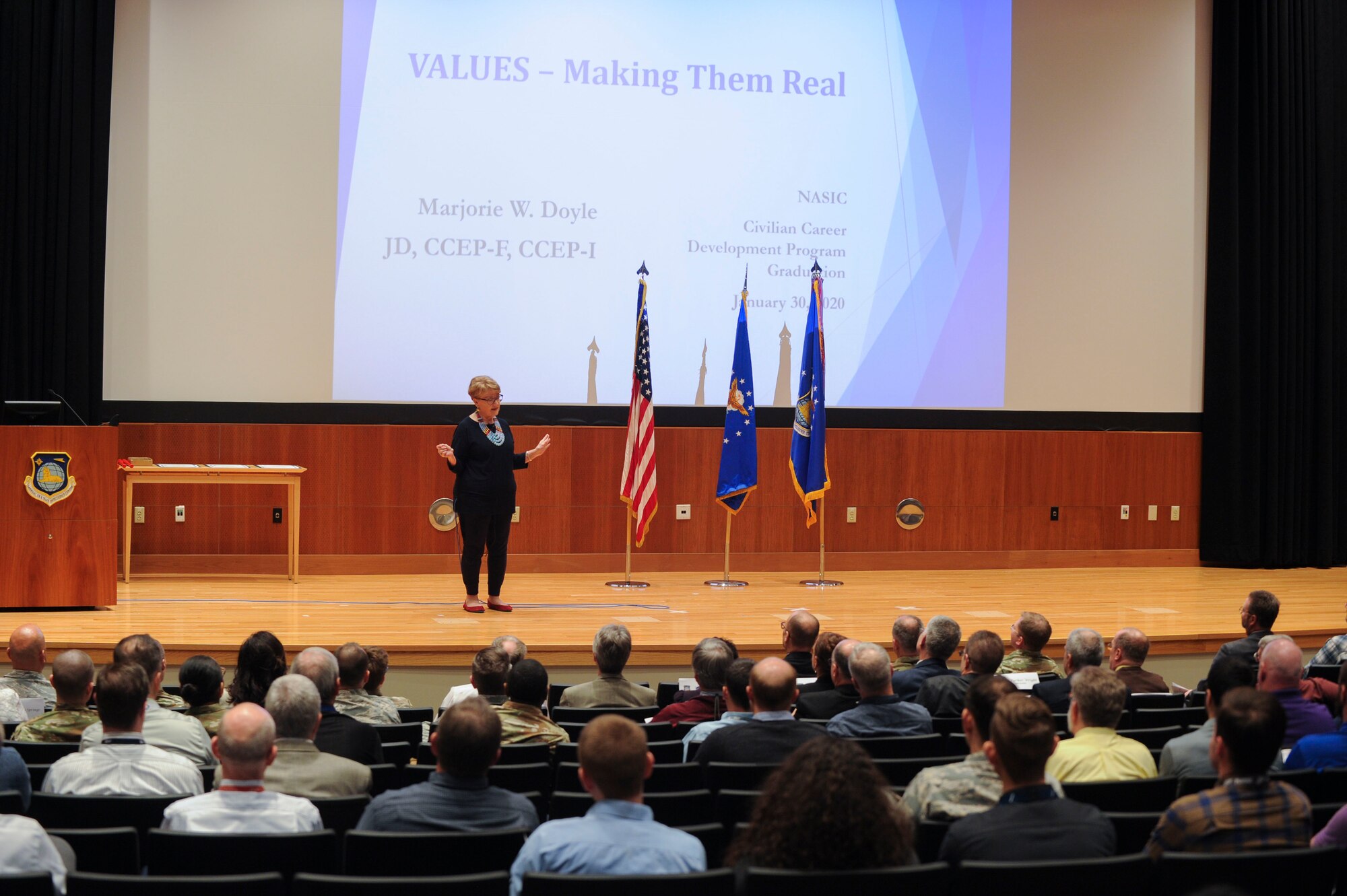 Marjorie Doyle, speaks to the audience during the National Air and Space Intelligence Center Civilian Career Development Program graduation ceremony, at Wright-Patterson AFB, Ohio, Jan. 30, 2020. During the event, Doyle shared her insights on how an organization must establish its values and consistently employ them to drive mission accomplishment and unit cohesion. (U.S. Air Force photo Staff Sgt. Seth Ray Stang)
