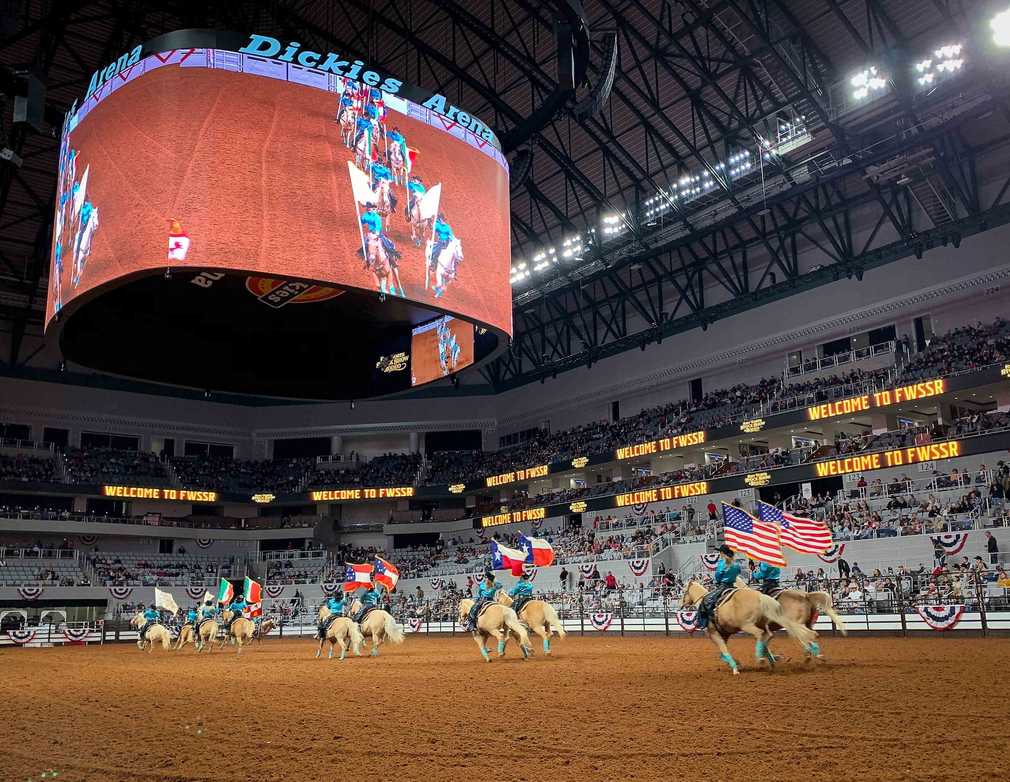 The six flags of Texas ride out on display  at the Fort Worth Stock Show and Rodeo at Dickie’s Arena on February 3, 2020. The FWSSR is the oldest continuously running livestock show and rodeo and has been held annually in Fort Worth, Texas since 1896. (U.S. Air Force Photo by Capt. Jessica Gross)