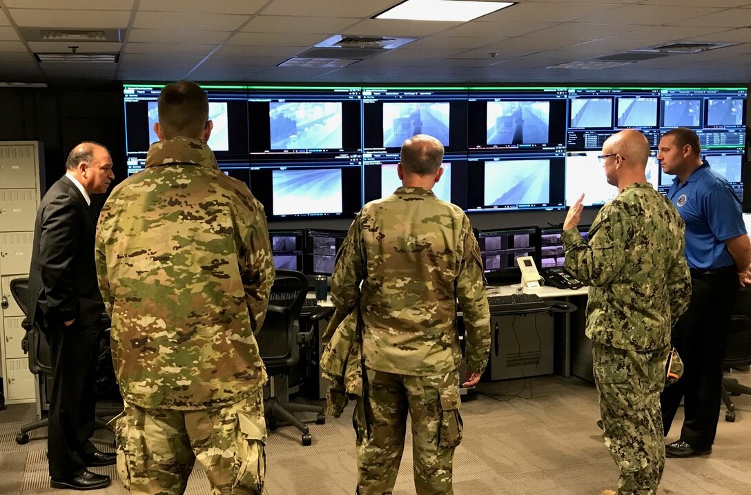 Naval District of Washington Commandant Rear Adm. Carl Lahti; Air Force District of Washington Commander Maj. Gen. Ricky N. Rupp; Air Force Element Commander and  Joint Base Anacostia-Bolling, D.C., Vice Commander Col. Michael J. Zuhlsdorf; and AFDW Logistics Director Col. Christoff Gaub toured the Shore Operations Center, ShOC, at Naval District of Washington Headquarters, D.C., Feb. 6. This expansive facility oversees the Virtual Perimeter Monitoring Systems of Naval installations in the National Capital Region, to include JBAB and the Naval Academy in Annapolis, Maryland. The system uses multiple layers of security at the defined perimeter to detect unauthorized access or breaching at the installations. (U.S. Air Force photo/Lt. Col. Michael Garrott)