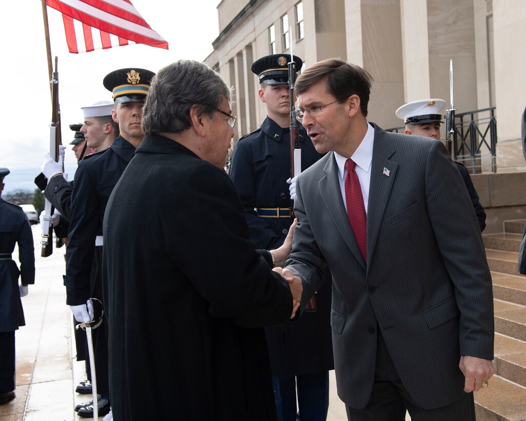 Men shake hands.