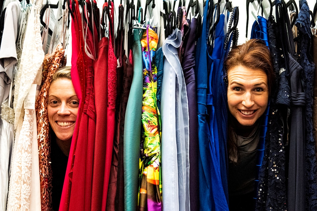 A photo of spouses posing for a photo.