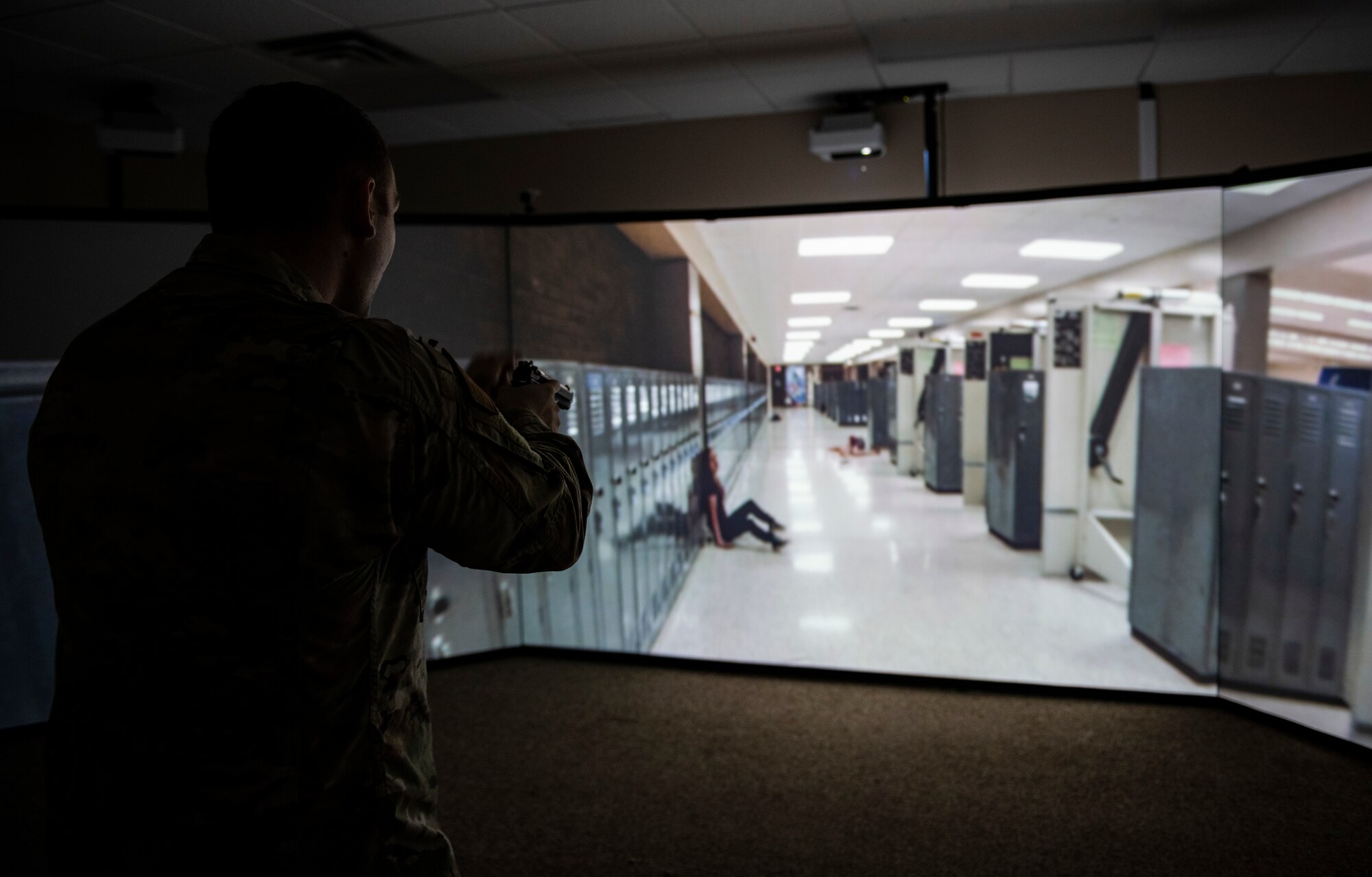 U.S. Air Force Staff Sgt. Thomas Badders, 325th Security Forces Squadron noncommissioned officer in charge of confinement, makes his way through a virtual active shooter training scenario at Tyndall Air Force Base, Florida, Feb. 5, 2020. Security Forces uses the Multiple Interactive Learning/Training Objectives Range to put it’s members in a life-like scenario. (U.S. Air Force photo by Senior Airman Stefan Alvarez)