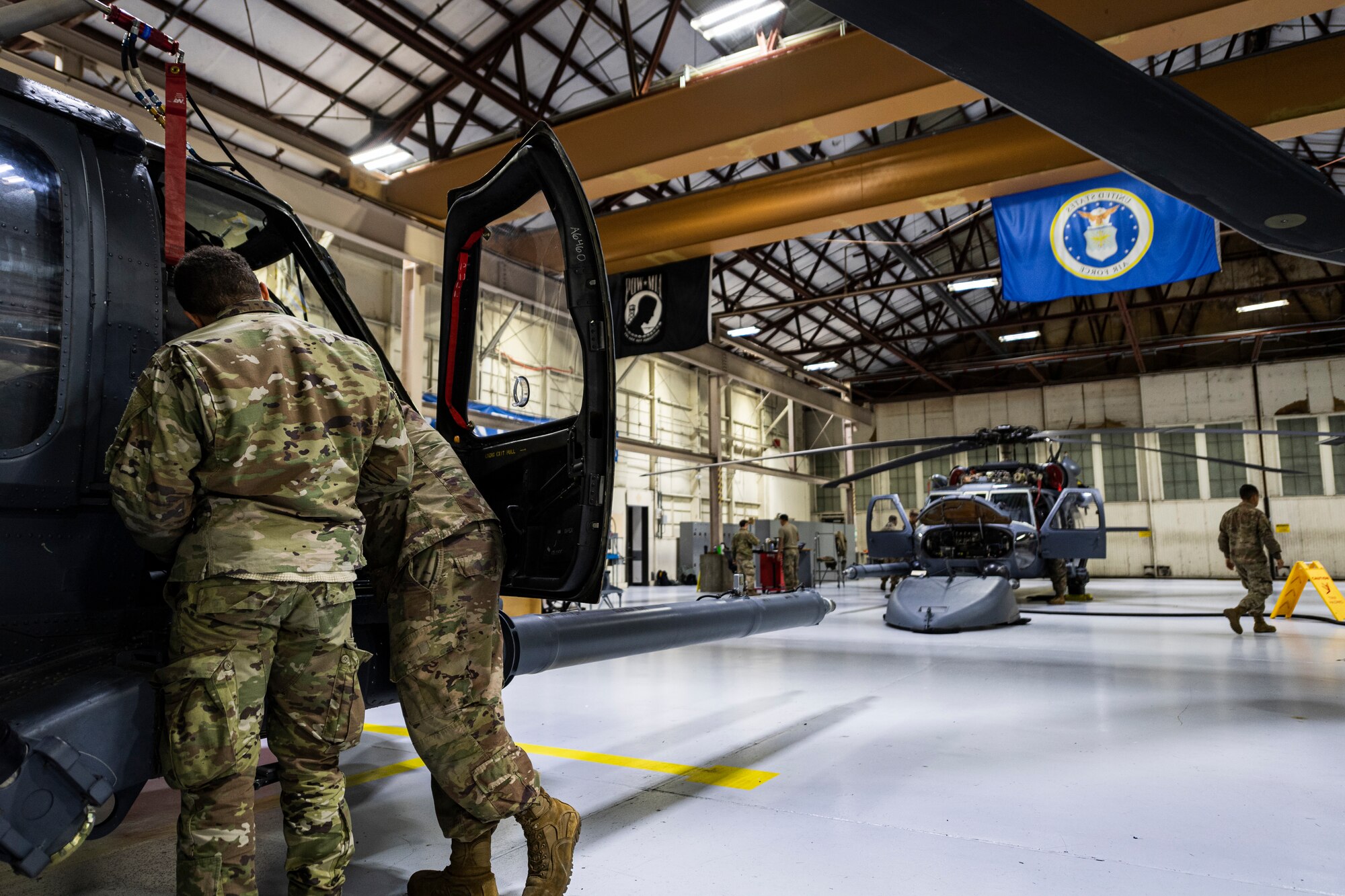 A photo of Airmen performing aircraft inspections.