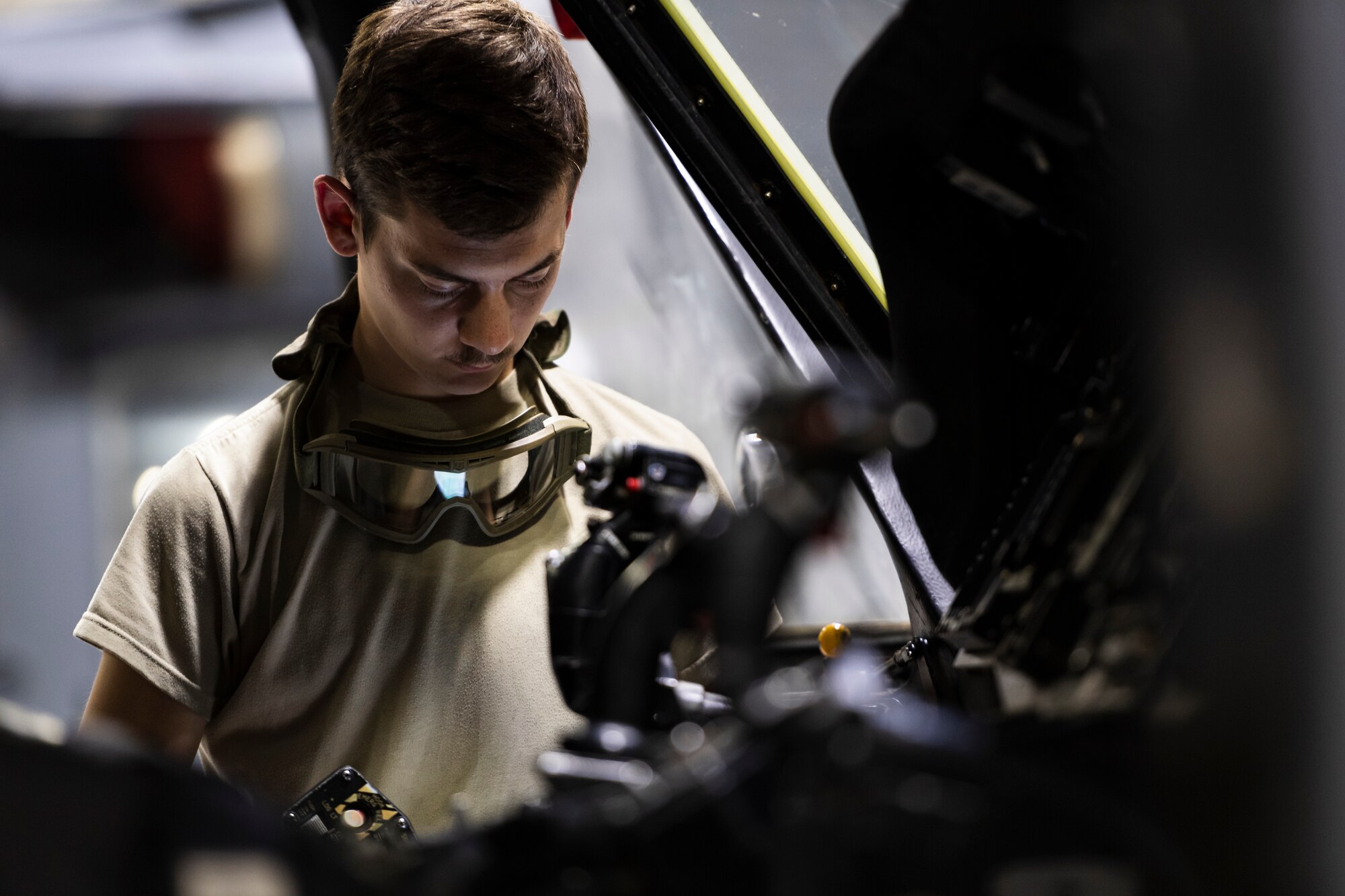 A photo of an Airman performing an aircraft inspection.
