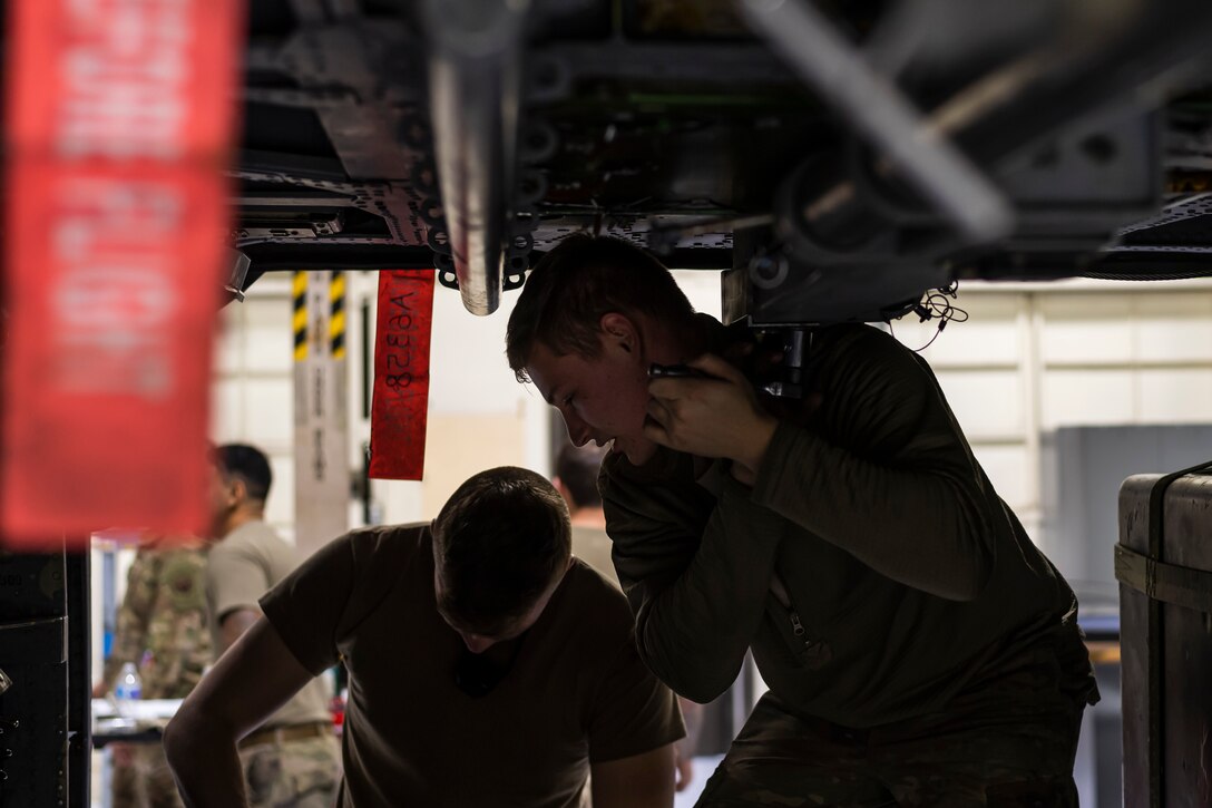 A photo of an Airman performing an aircraft inspection.