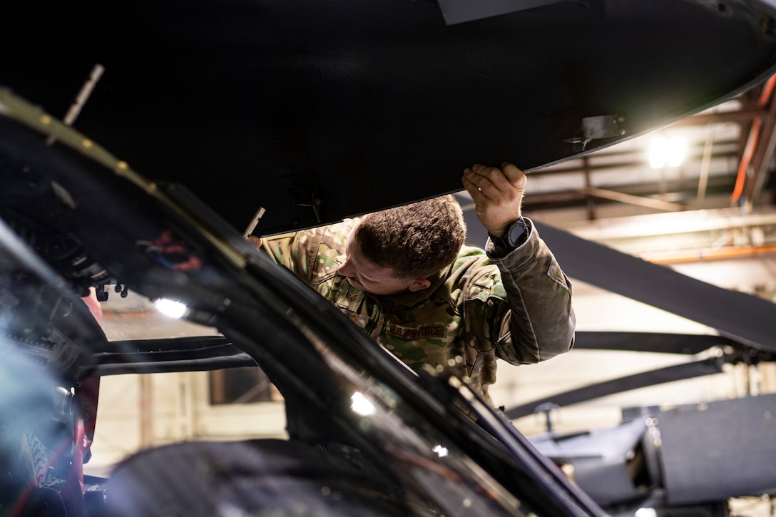 A photo of an Airman performing an aircraft inspection.