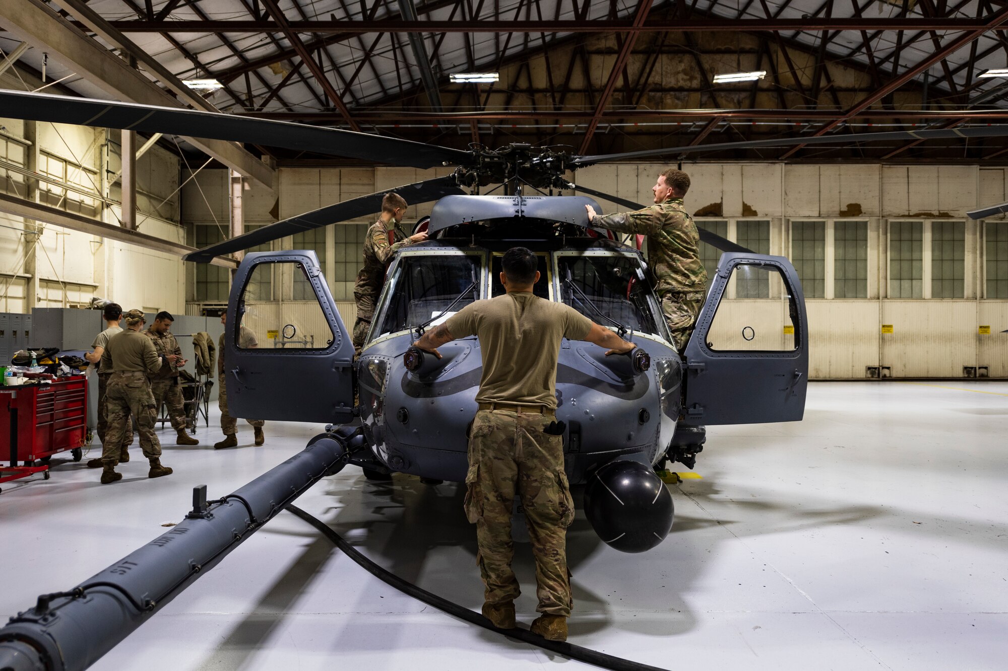 A photo of Airmen performing an aircraft inspection.