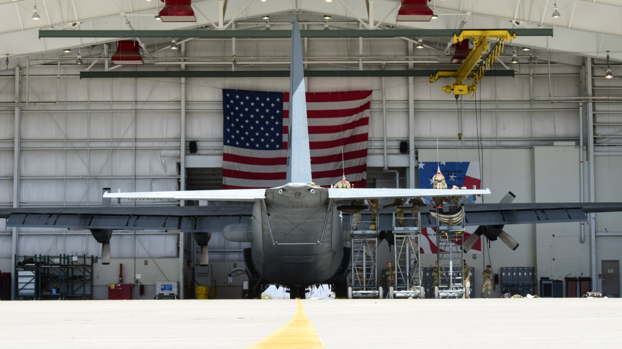 Maintainers work on aircraft