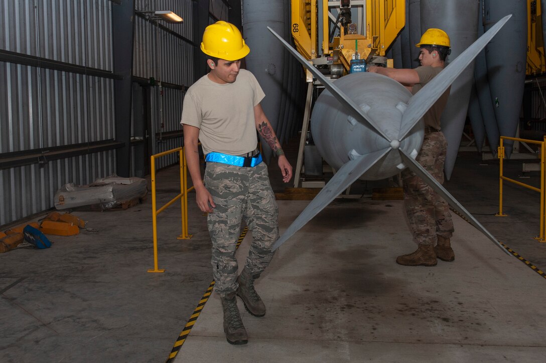 Photo of Airmen inspecting a fuel cell