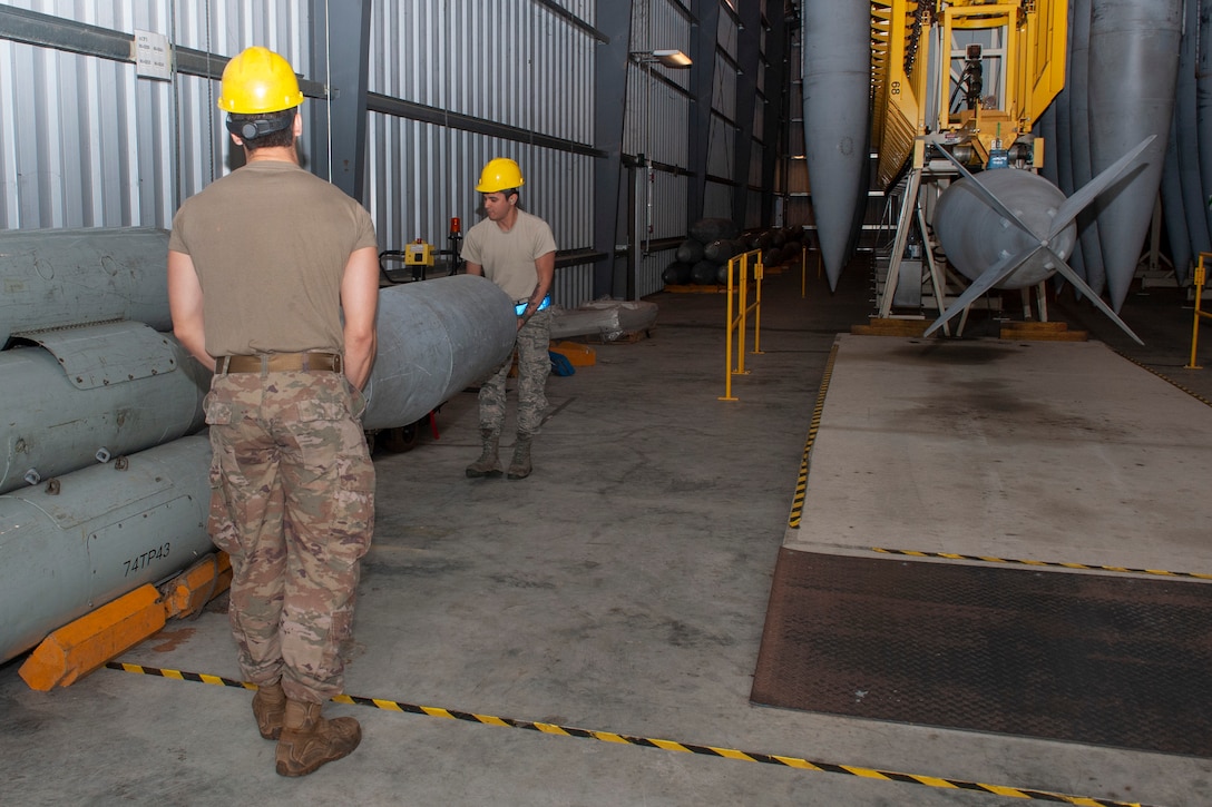 Photo of Airmen carrying a fuel cell
