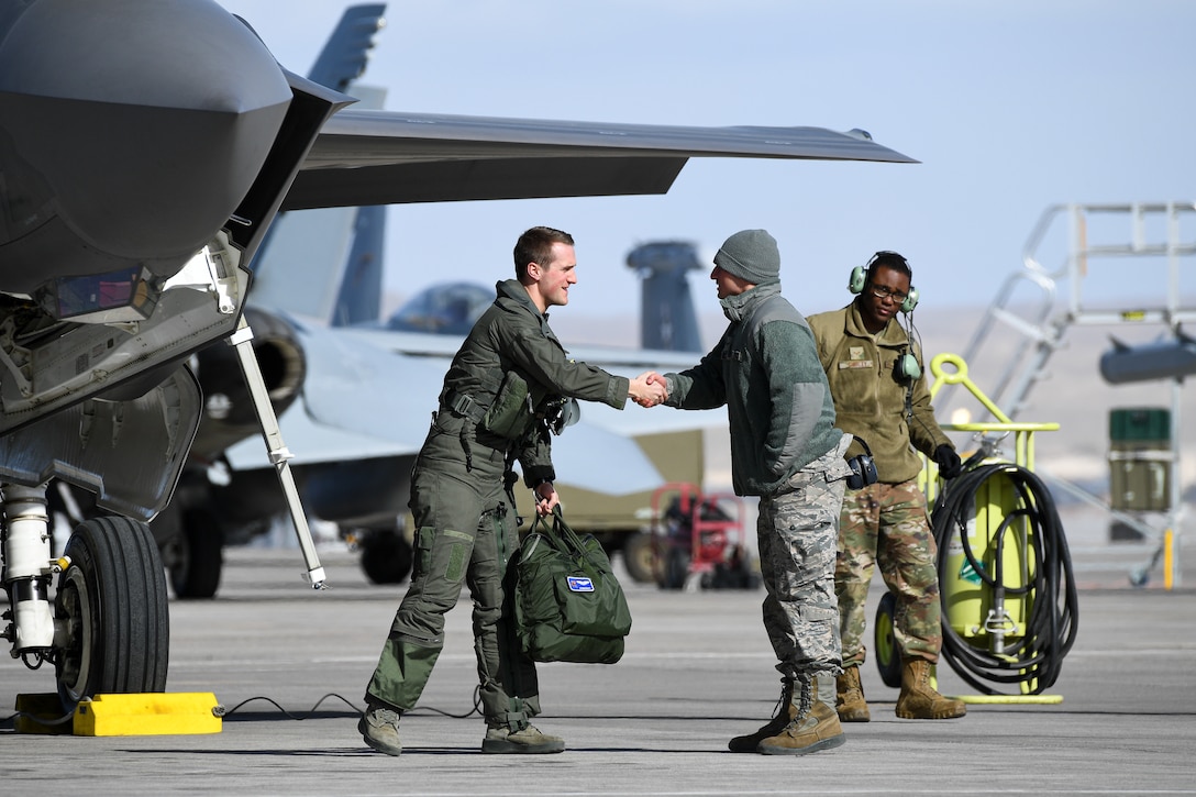 A photo of Airmen on the flight line at Nellis Air Force Base.