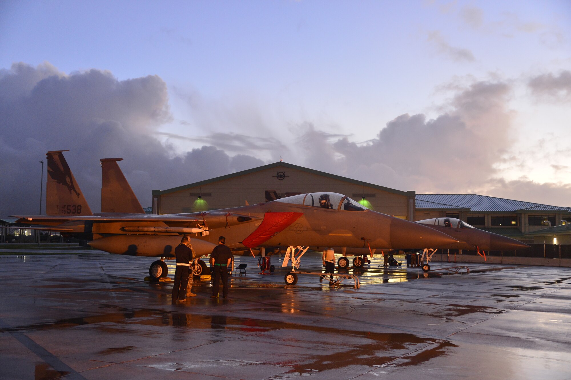 Crew chiefs assigned to the 144th Fighter Wing prep an F-15C Eagle for a morning mission Jan. 9, 2020
