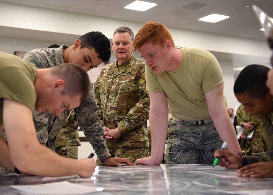 U.S. Air Force Lt. Gen. Brad Webb, commander of Air Education and Training Command, watches students perform the Mental Health Obstacle Course at the Cressman Dining Facility on Goodfellow Air Force Base, Texas, Feb. 6, 2020. The course is designed to help students manage stress and build resiliency. (U.S. Air Force photo by Airman 1st Class Ethan Sherwood)
