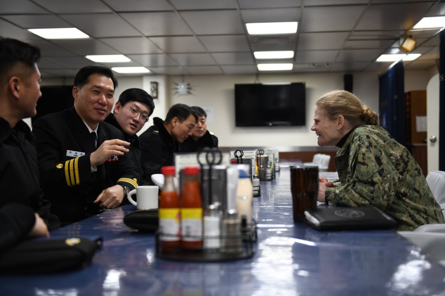 U.S. 7th Fleet Surgeon, Capt. Christine L. G. Sears, from Norfolk, Virginia, speaks with Republic of Korea Navy Fleet Surgeon, Cmdr. Jae-hyon Park prior to a medical demonstration held aboard U.S. 7th Fleet flagship, USS Blue Ridge. Blue Ridge with embarked U.S. 7th Fleet Sailors arrived in Busan, Republic of Korea (ROK) for a regularly scheduled port visit Feb. 5. During their visit they will engage in local culture, host military-to-military engagements and build relationships through music and public service activities.