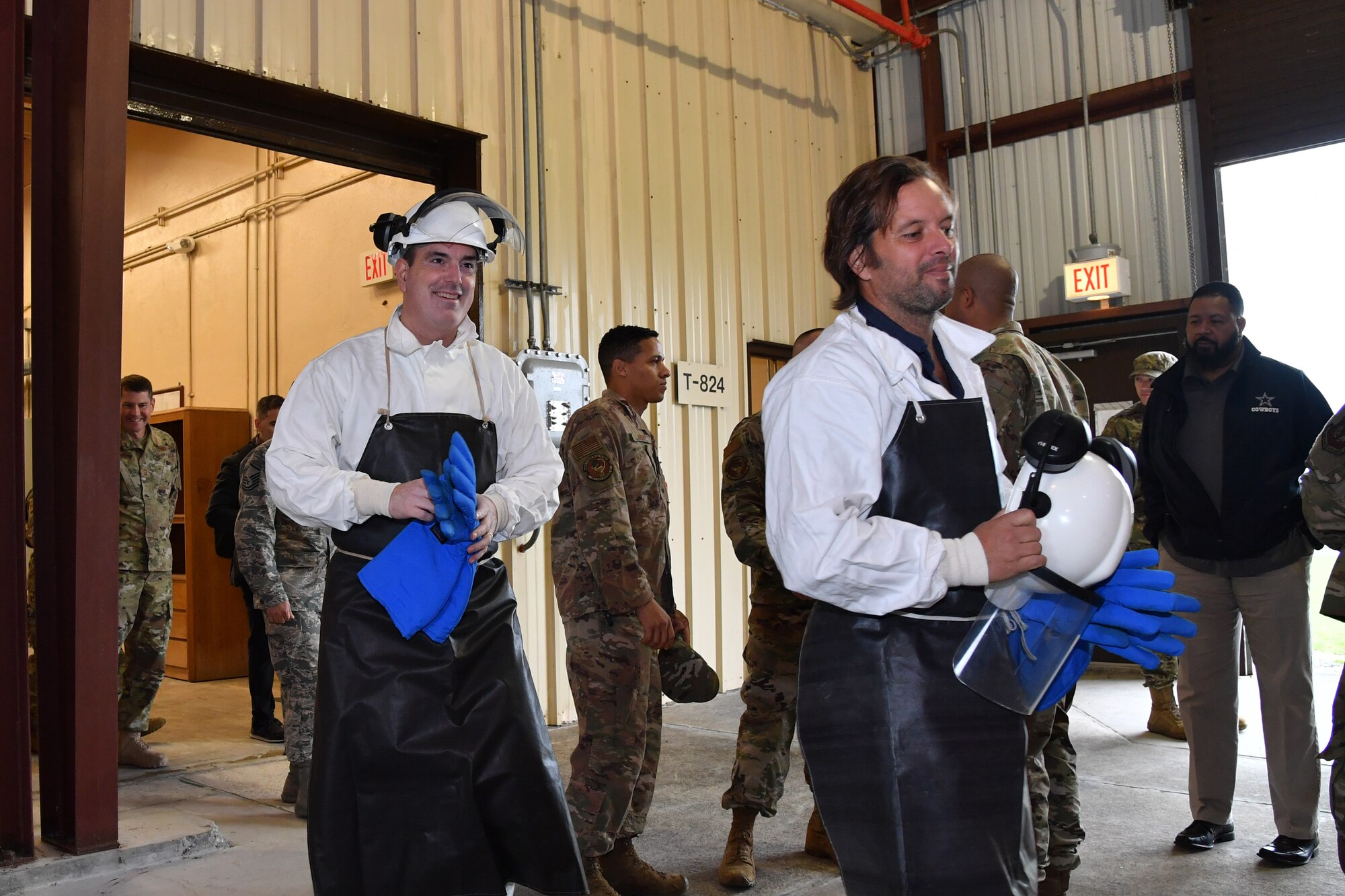 U.S. Air Force Brig. Gen. Mark R. August, 86th Airlift Wing commander, left, wears personal protective equipment while visiting a cryogenic facility, Lajes Field, Portugal, Jan. 21, 2020.